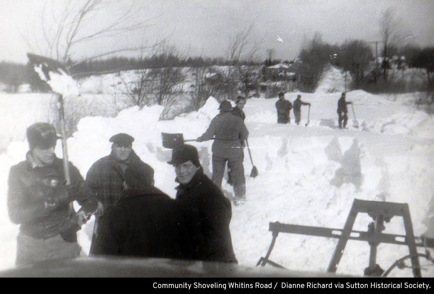 Community shoveling on Whitins Road — caption credit is part of the photograph